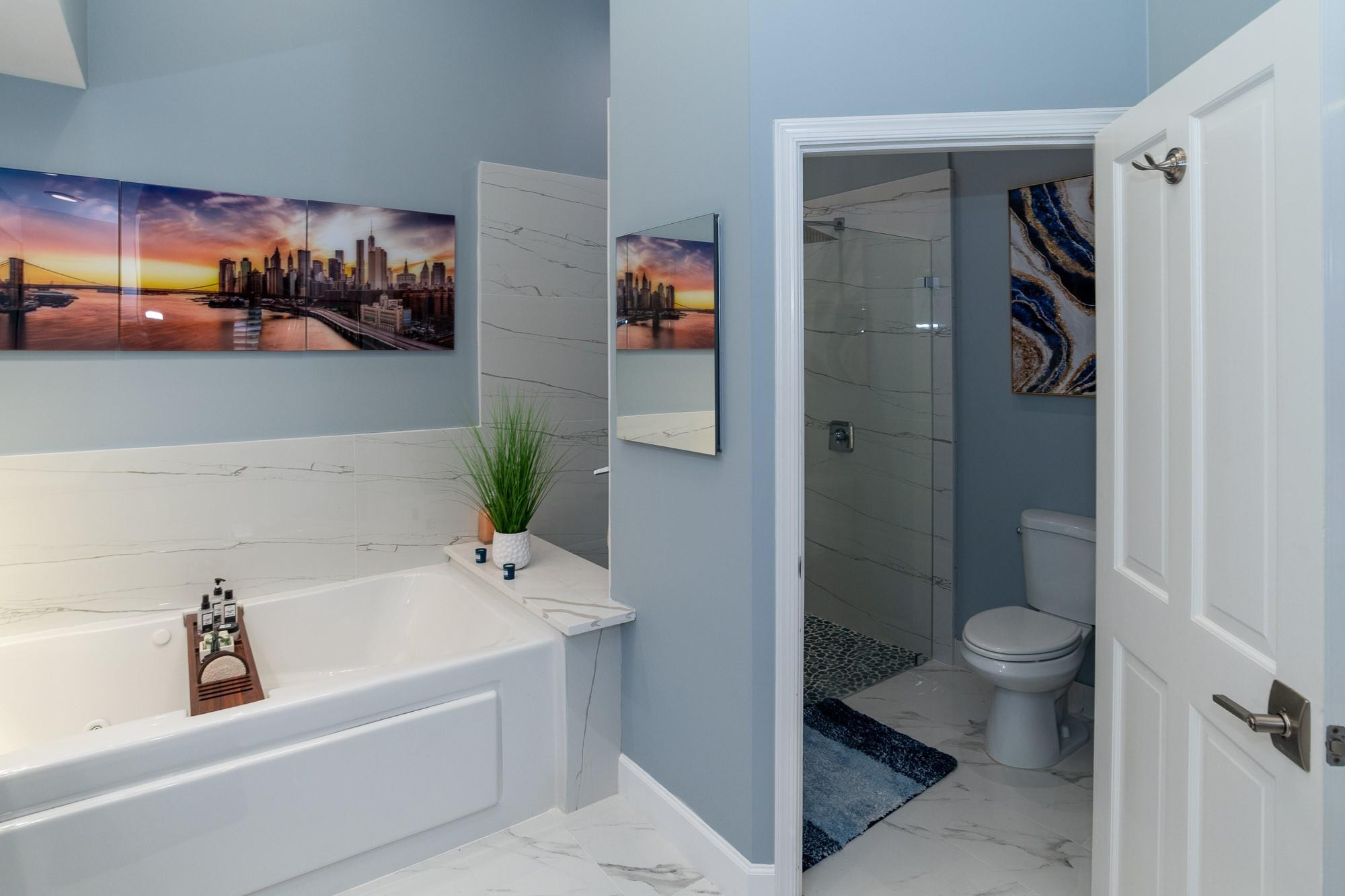 6192 Northwest 24th Street Boca Raton, FL 33434 - Photo 19 of 57 a bathroom with a bathtub and a toilet