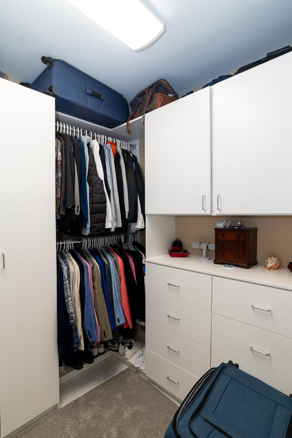 6192 Northwest 24th Street Boca Raton, FL 33434 - Photo 21 of 57 a view of walk in closet with clothes and shoes
