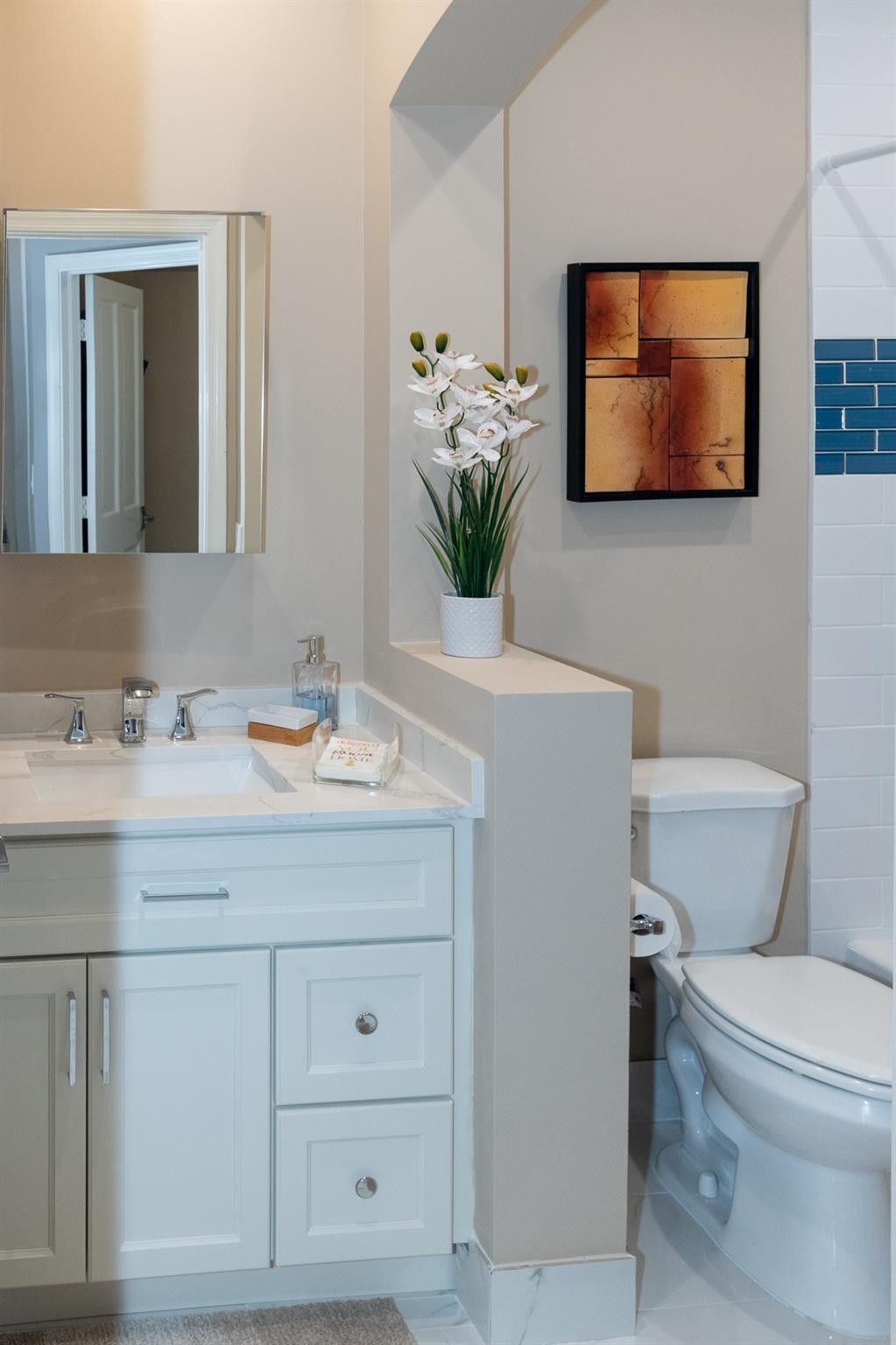 6192 Northwest 24th Street Boca Raton, FL 33434 - Photo 24 of 57 a bathroom with a toilet a sink and mirror