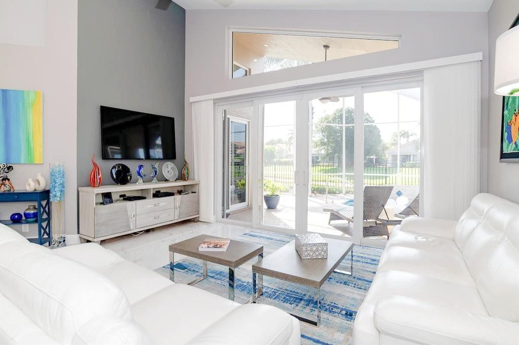 6192 Northwest 24th Street Boca Raton, FL 33434 - Photo 3 of 57 a living room with furniture and a flat screen tv
