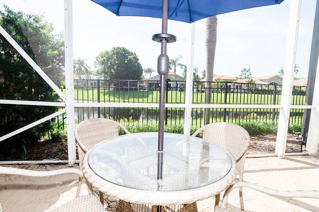 6192 Northwest 24th Street Boca Raton, FL 33434 - Photo 33 of 57 a view of a balcony with a table and chairs