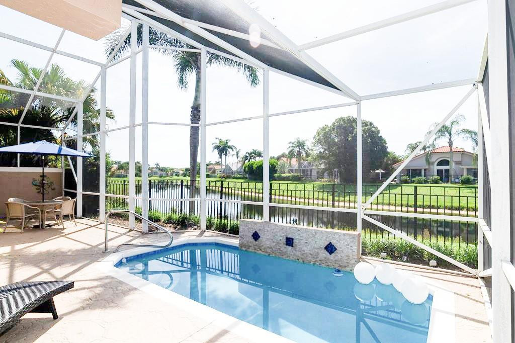 6192 Northwest 24th Street Boca Raton, FL 33434 - Photo 34 of 57 a view of roof deck with wooden floor and iron fence