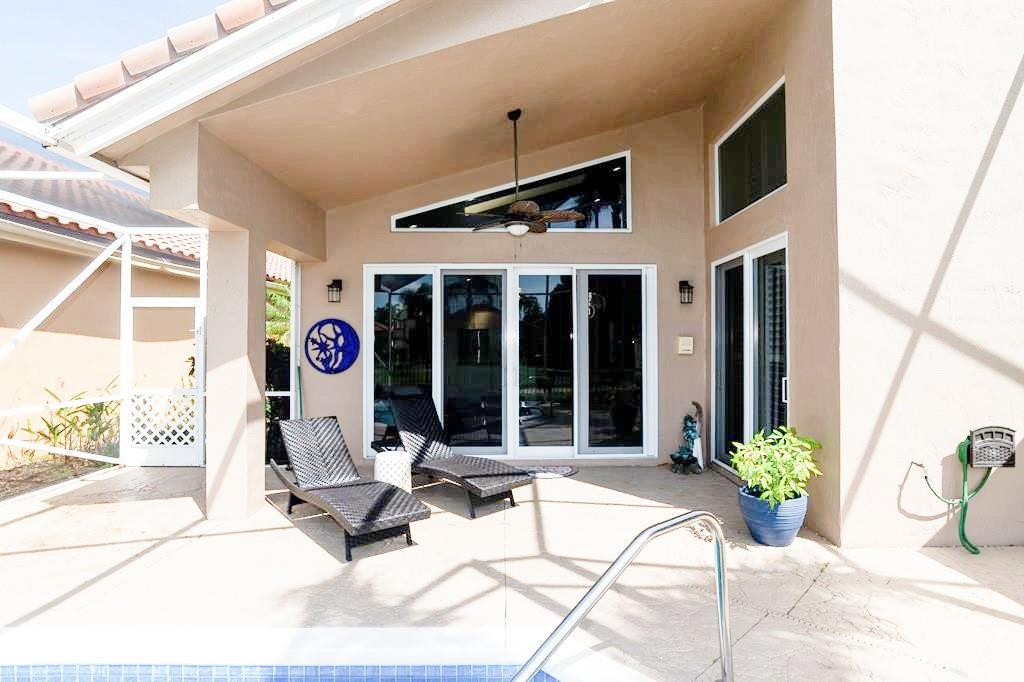 6192 Northwest 24th Street Boca Raton, FL 33434 - Photo 35 of 57 a building outdoor space with windows and potted plants