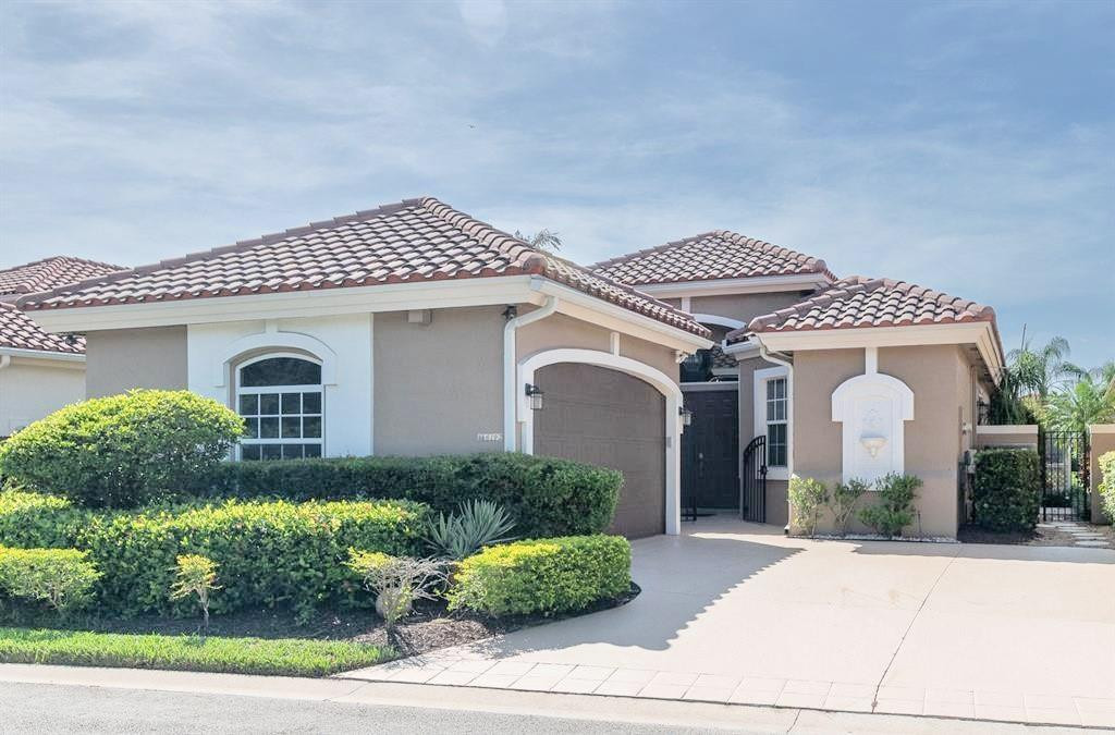 6192 Northwest 24th Street Boca Raton, FL 33434 - Photo 38 of 57 a front view of a house with a yard