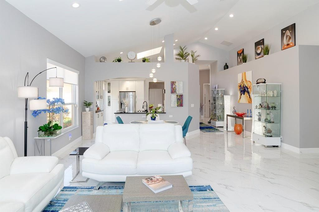 6192 Northwest 24th Street Boca Raton, FL 33434 - Photo 4 of 57 a large white room with lots of white furniture
