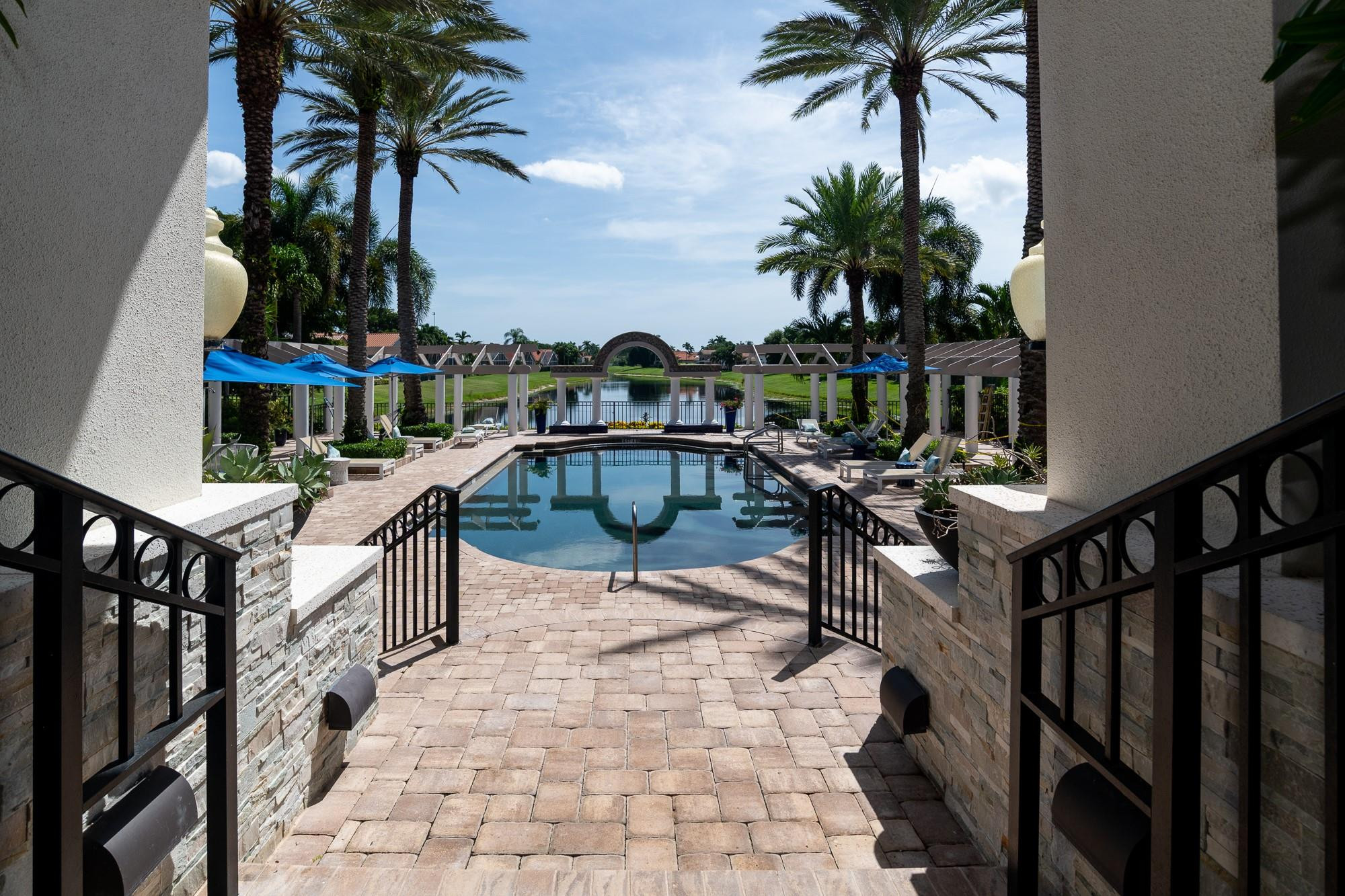 6192 Northwest 24th Street Boca Raton, FL 33434 - Photo 45 of 57 a swimming pool with outdoor seating and plants
