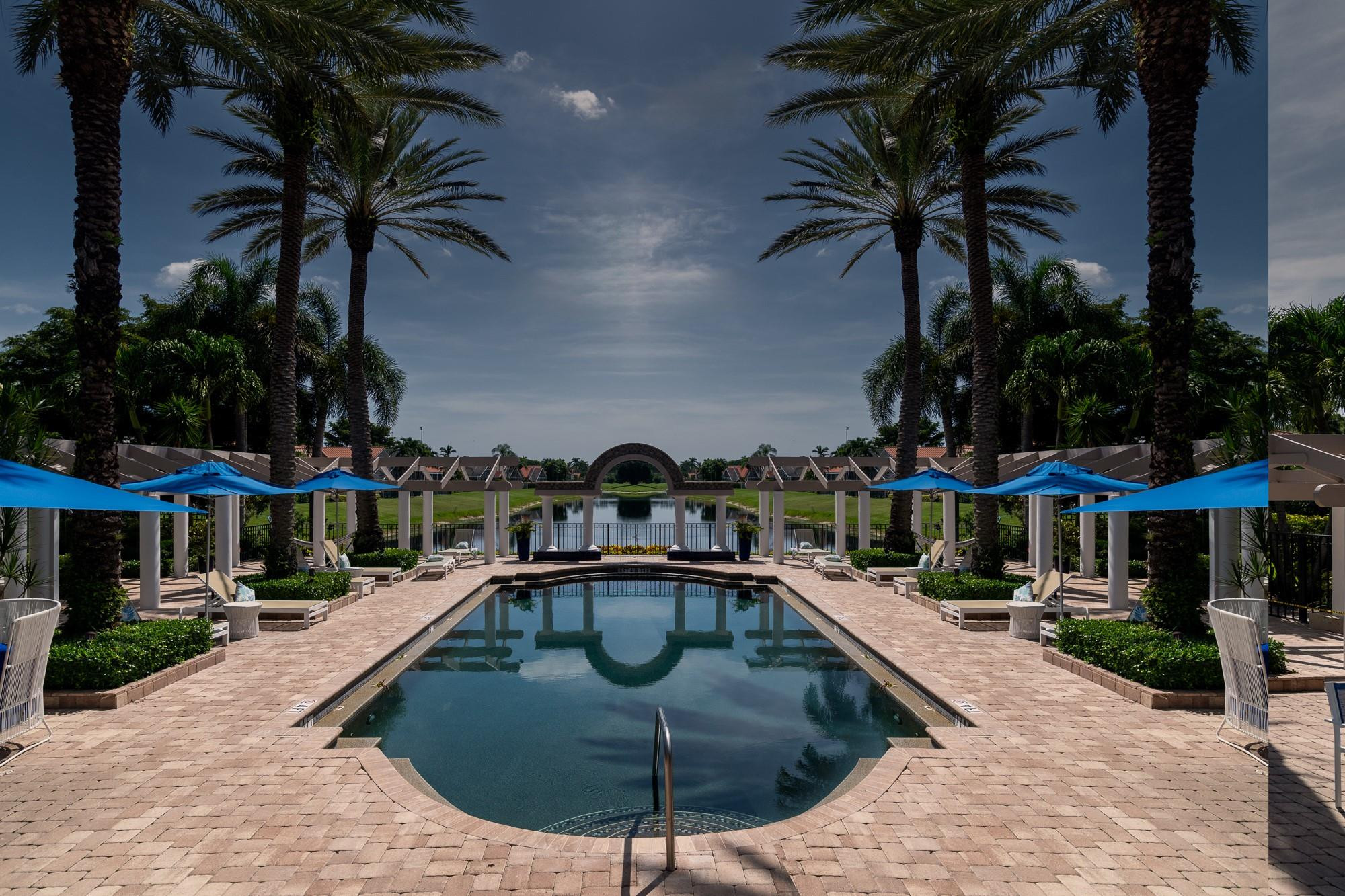 6192 Northwest 24th Street Boca Raton, FL 33434 - Photo 46 of 57 a swimming pool with outdoor seating and yard
