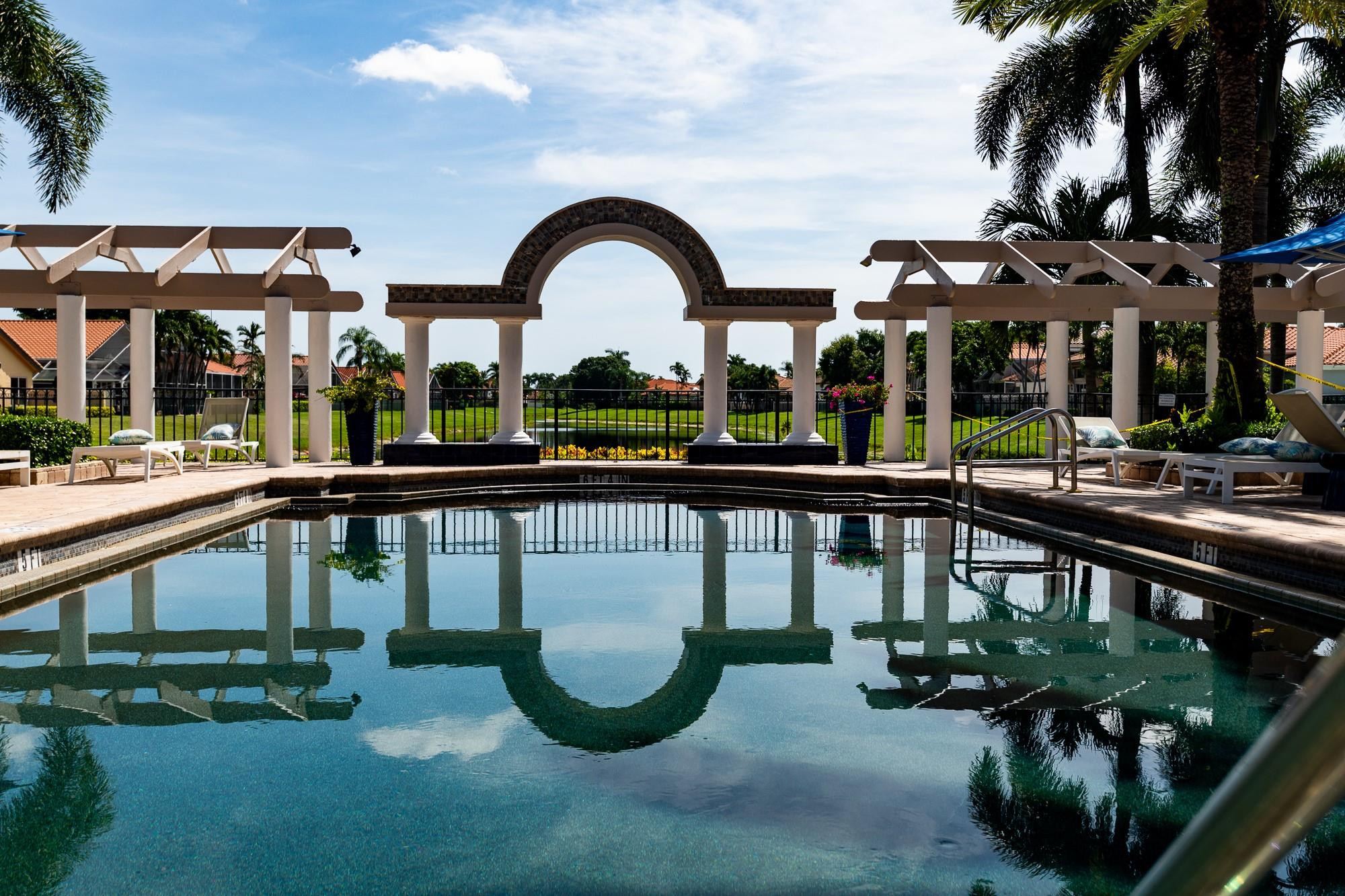 6192 Northwest 24th Street Boca Raton, FL 33434 - Photo 48 of 57 a view of swimming pool with outdoor seating and plants