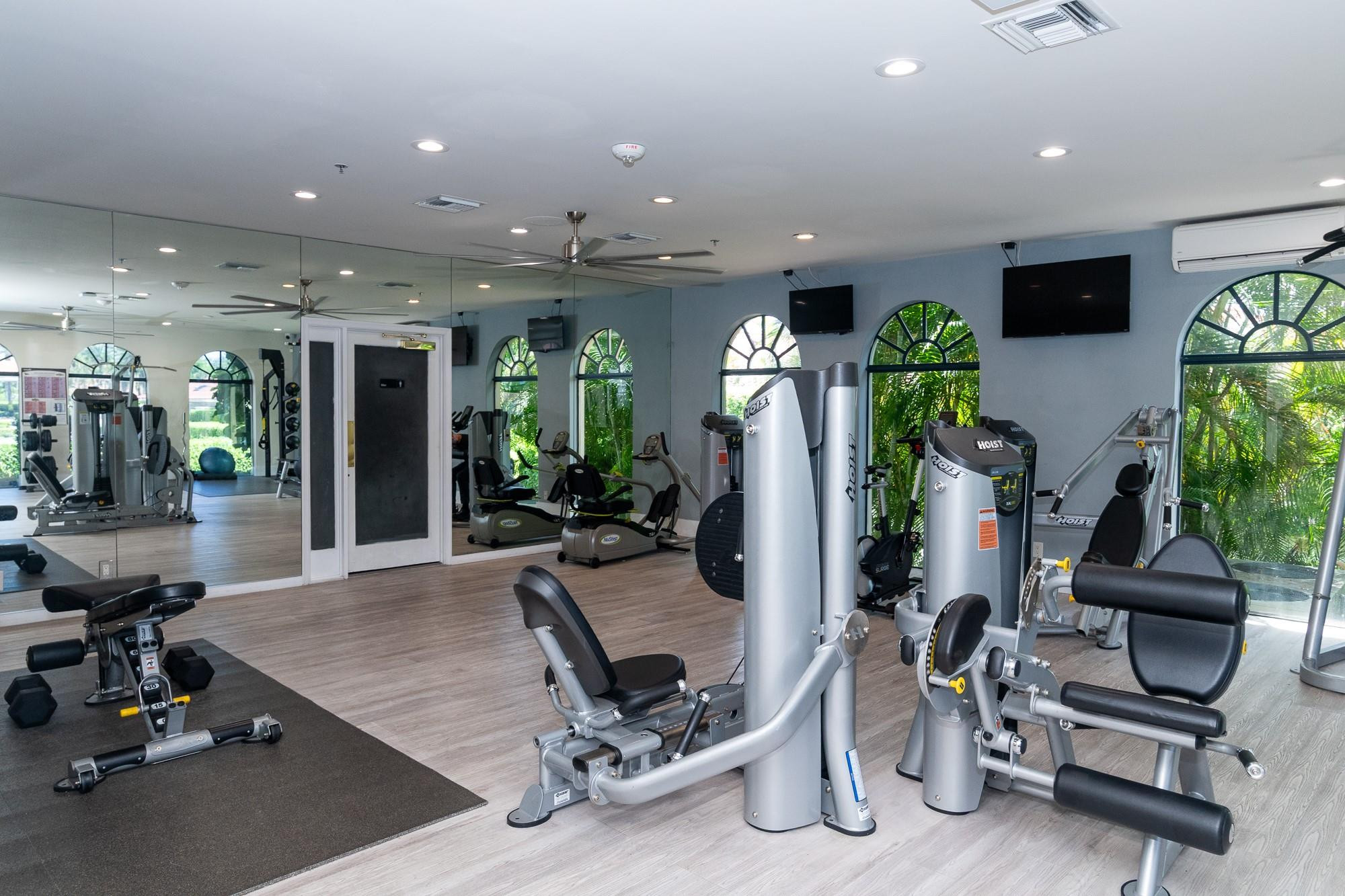 6192 Northwest 24th Street Boca Raton, FL 33434 - Photo 53 of 57 a room with gym equipment and view of living room
