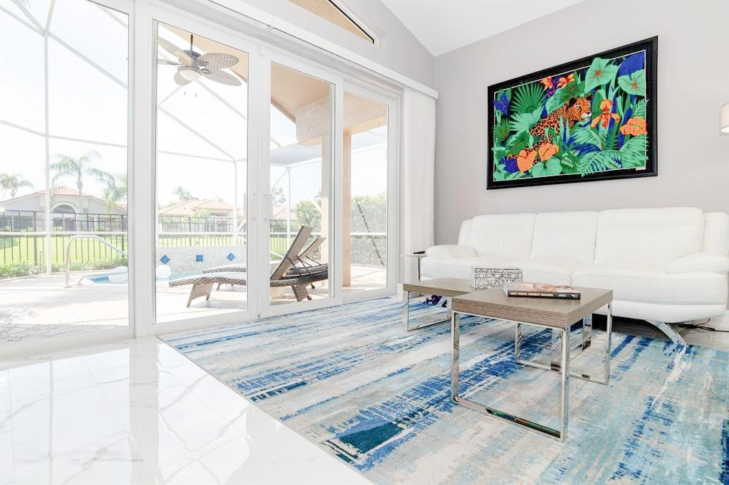 6192 Northwest 24th Street Boca Raton, FL 33434 - Photo 6 of 57 a living room with couch and floor to ceiling windows