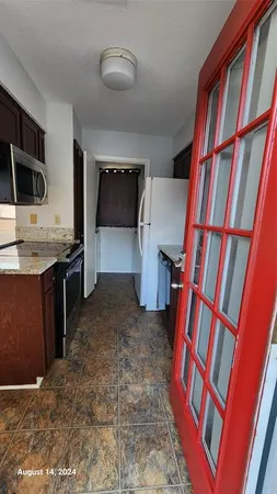 a view of a livingroom with a flat screen tv