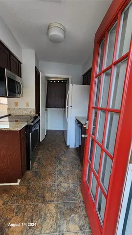 a view of a livingroom with a flat screen tv