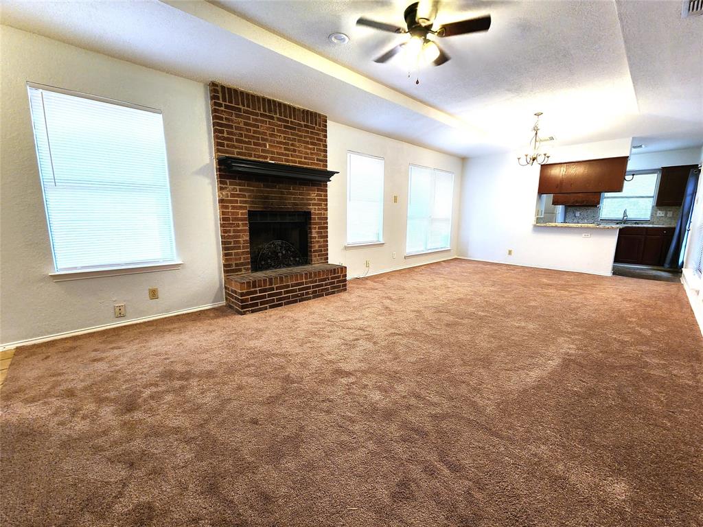 2202 Bolivar Street Denton, TX 76201 - Photo 14 of 36 a view of empty room with a fireplace