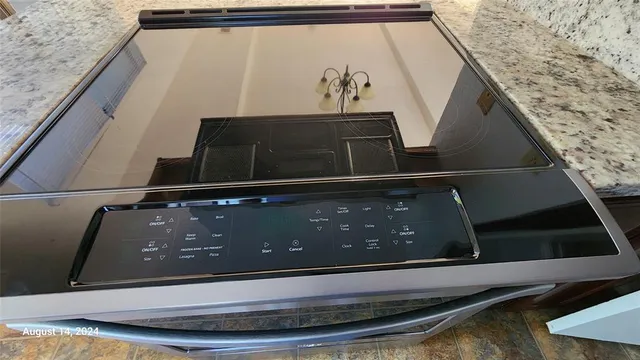 a kitchen with stainless steel appliances a refrigerator sink and cabinets