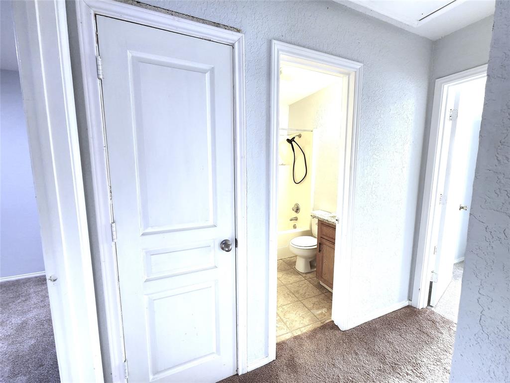 2202 Bolivar Street Denton, TX 76201 - Photo 26 of 36 a view of a bathroom from a hallway
