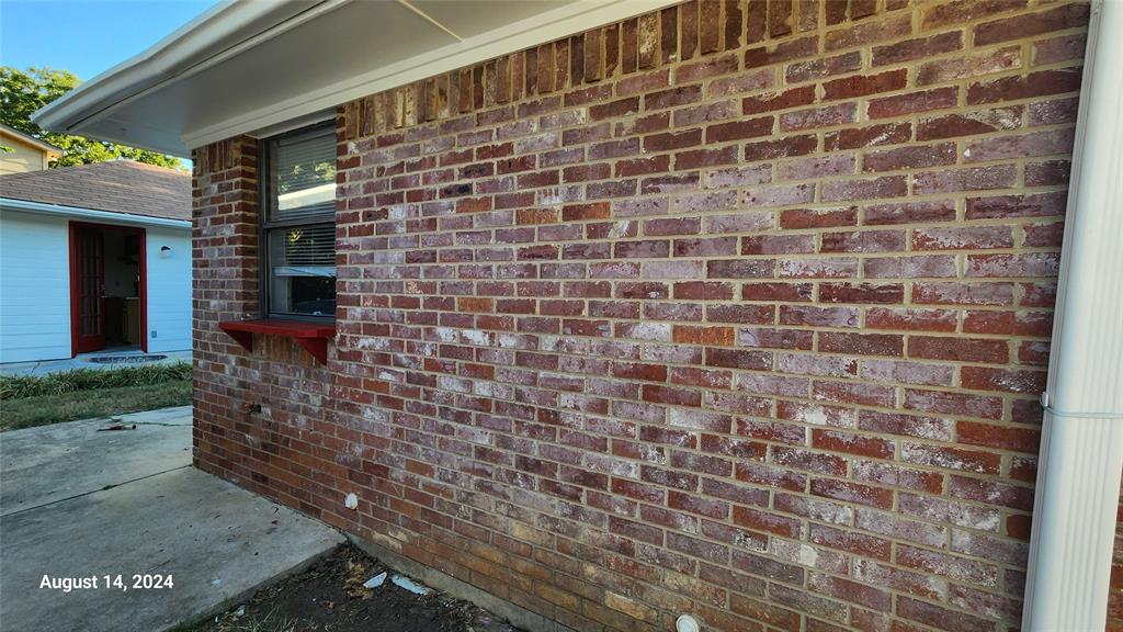 2202 Bolivar Street Denton, TX 76201 - Photo 5 of 36 a brick building with a window