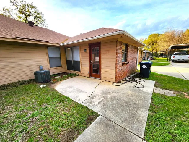 a kitchen with granite countertop a sink and a stove top oven