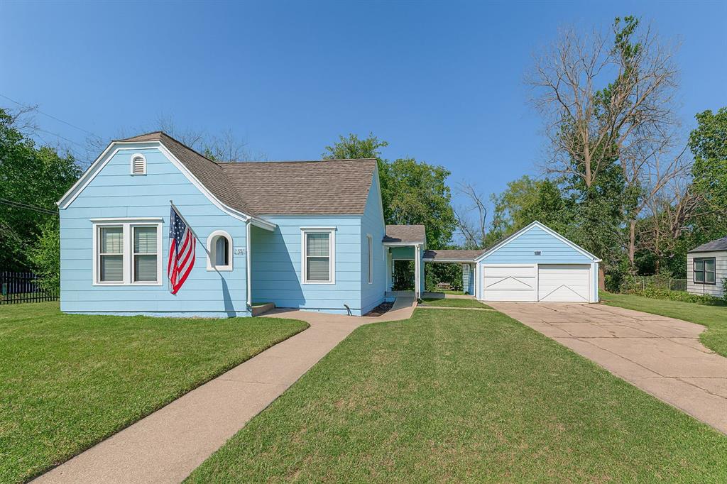 3244 Ryan Avenue Fort Worth, TX 76110 - Photo 1 of 31 a front view of a house with a yard and garage