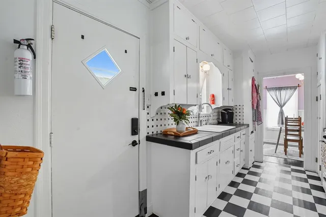 a kitchen with a sink and a refrigerator