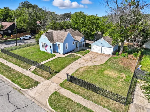 a aerial view of a house with a yard
