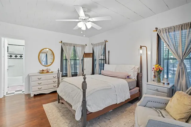 a bathroom with a sink a toilet and shower curtain