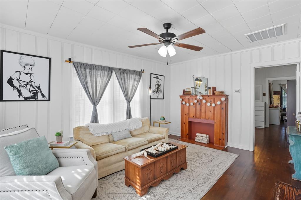 3244 Ryan Avenue Fort Worth, TX 76110 - Photo 5 of 31 a living room with furniture and a wooden floor