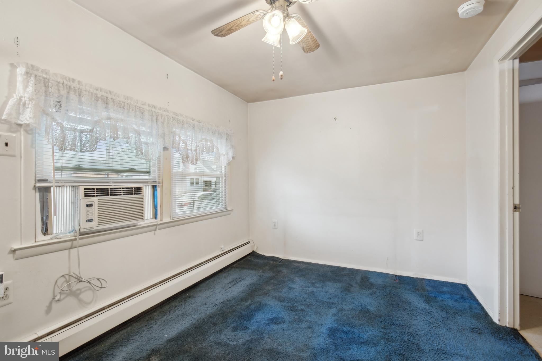 1600 Oriole Road Edgewater, MD 21037 - Photo 23 of 41 wooden floor in an empty room with a window