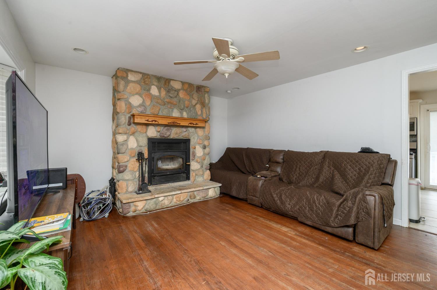384 Cook Road Jackson, NJ 08527 - Photo 3 of 31 a living room with furniture and a fireplace