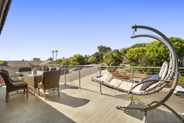 a view of a swimming pool with lounge chairs