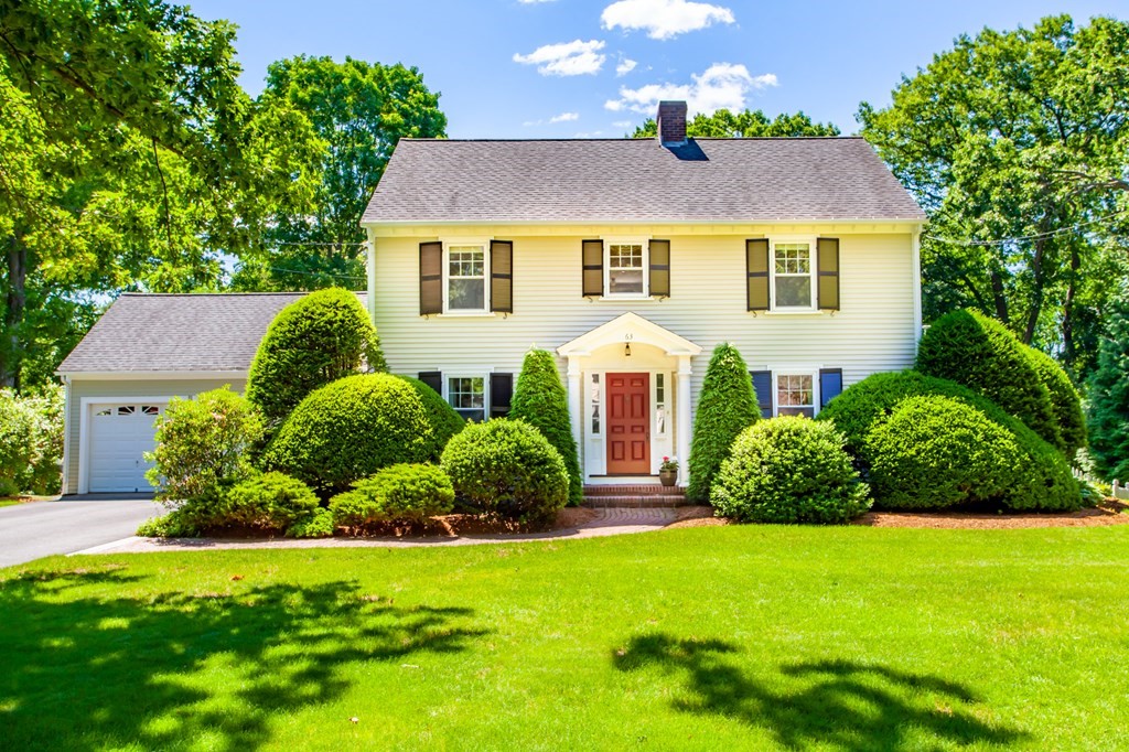 63 Dalton Road Chelmsford, MA 01824 - Photo 1 of 27 a view of a house with a yard and potted plants