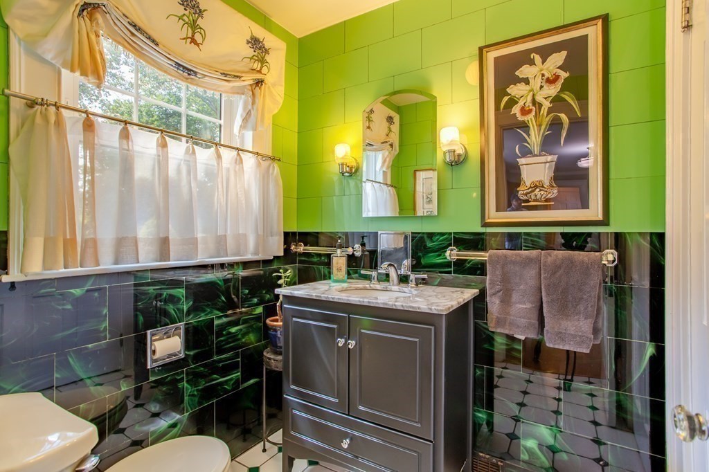 63 Dalton Road Chelmsford, MA 01824 - Photo 11 of 27 a bathroom with a sink a toilet and mirror