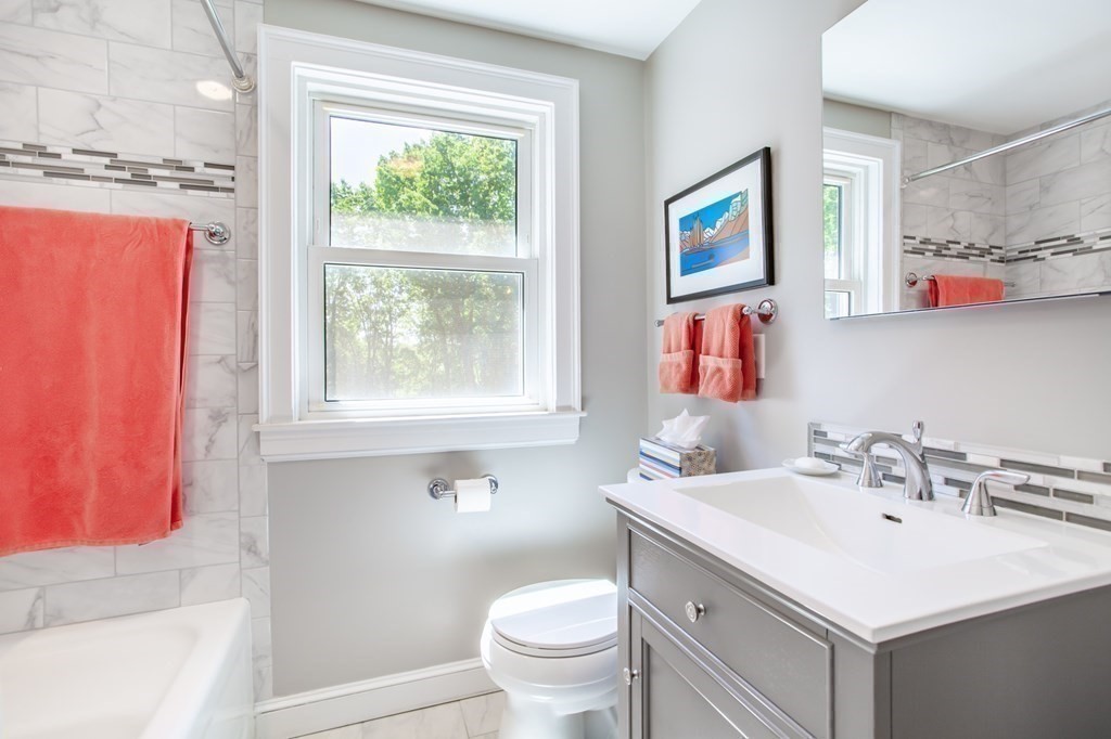 63 Dalton Road Chelmsford, MA 01824 - Photo 15 of 27 a bathroom with a sink a toilet and a window