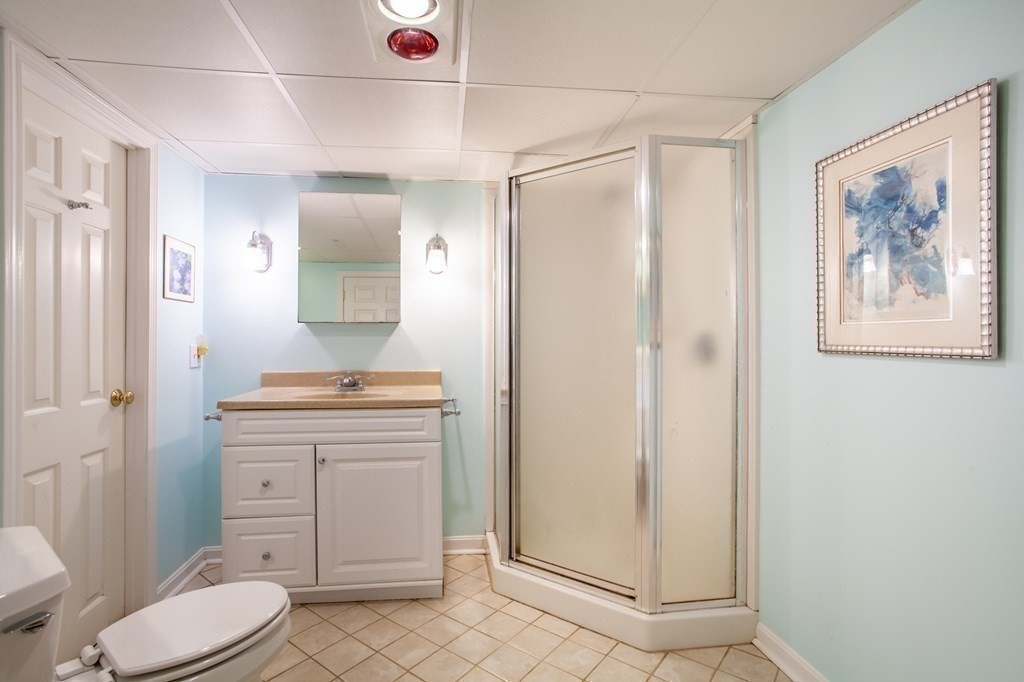 63 Dalton Road Chelmsford, MA 01824 - Photo 20 of 27 a bathroom with a sink a toilet and shower