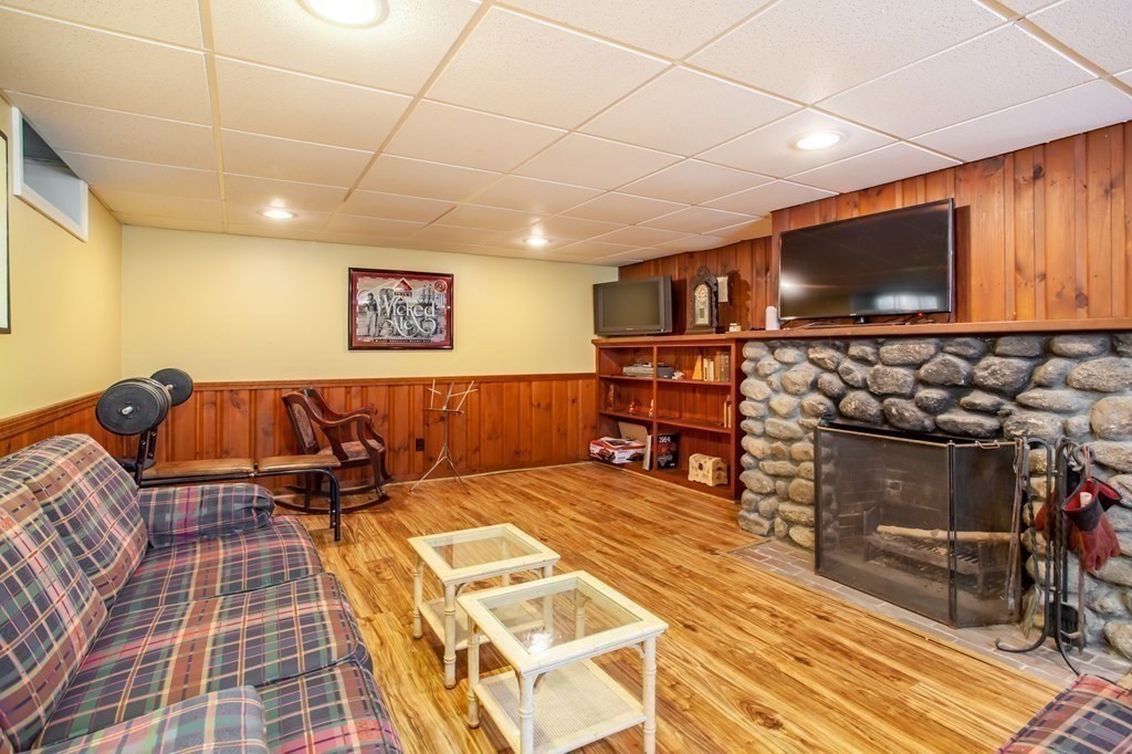 63 Dalton Road Chelmsford, MA 01824 - Photo 21 of 27 a living room with furniture a flat screen tv and kitchen view