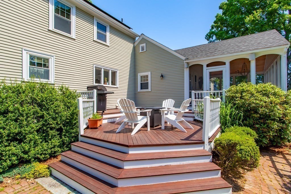 63 Dalton Road Chelmsford, MA 01824 - Photo 25 of 27 a view of a house with a chairs in patio