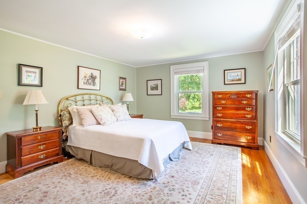 63 Dalton Road Chelmsford, MA 01824 - Photo 27 of 27 a bedroom with a bed and a dresser next to a window