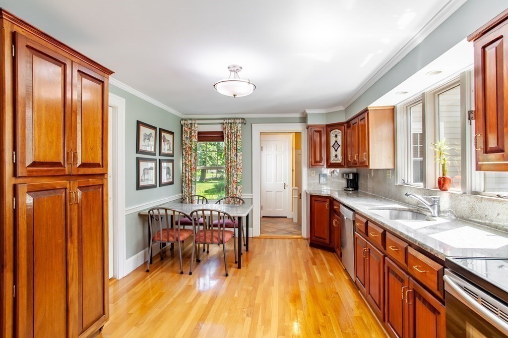63 Dalton Road Chelmsford, MA 01824 - Photo 3 of 27 a large kitchen with a large window and wooden floor