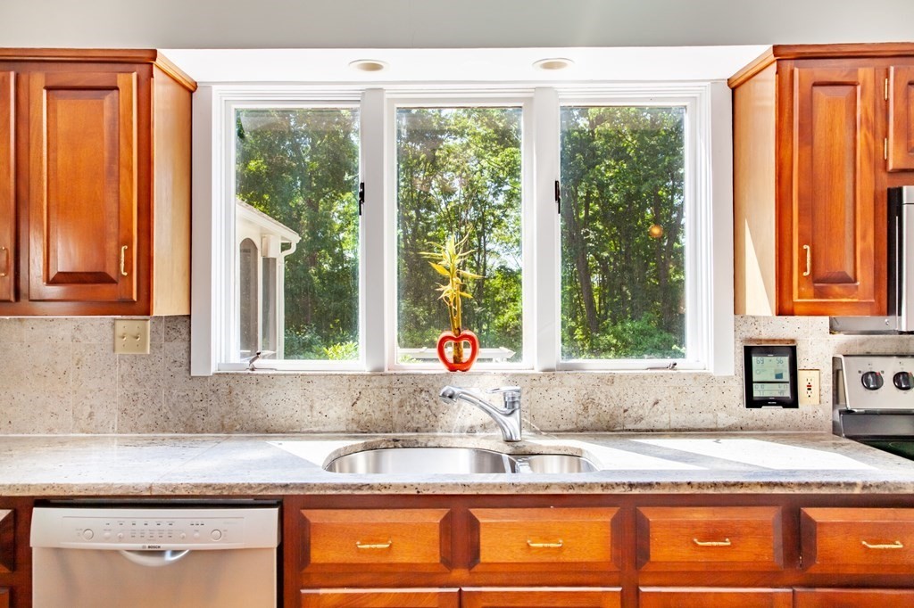 63 Dalton Road Chelmsford, MA 01824 - Photo 5 of 27 a kitchen with granite countertop sink and window