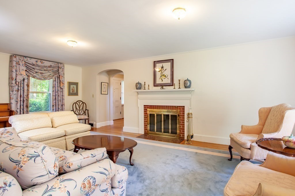 63 Dalton Road Chelmsford, MA 01824 - Photo 6 of 27 a living room with furniture and a fireplace