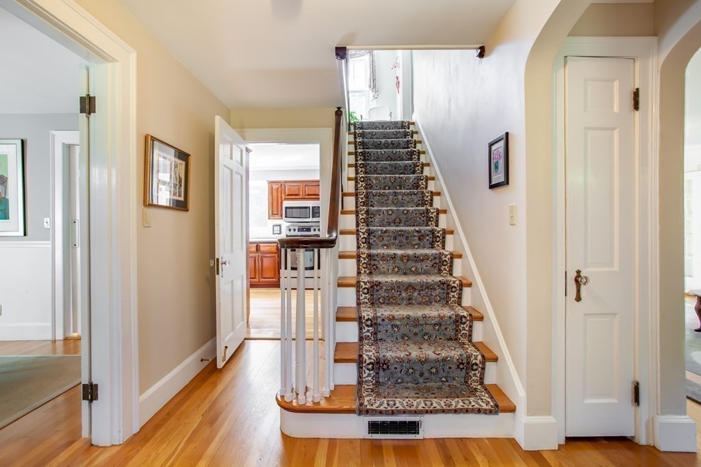 63 Dalton Road Chelmsford, MA 01824 - Photo 7 of 27 a view of entryway and hall with wooden floor