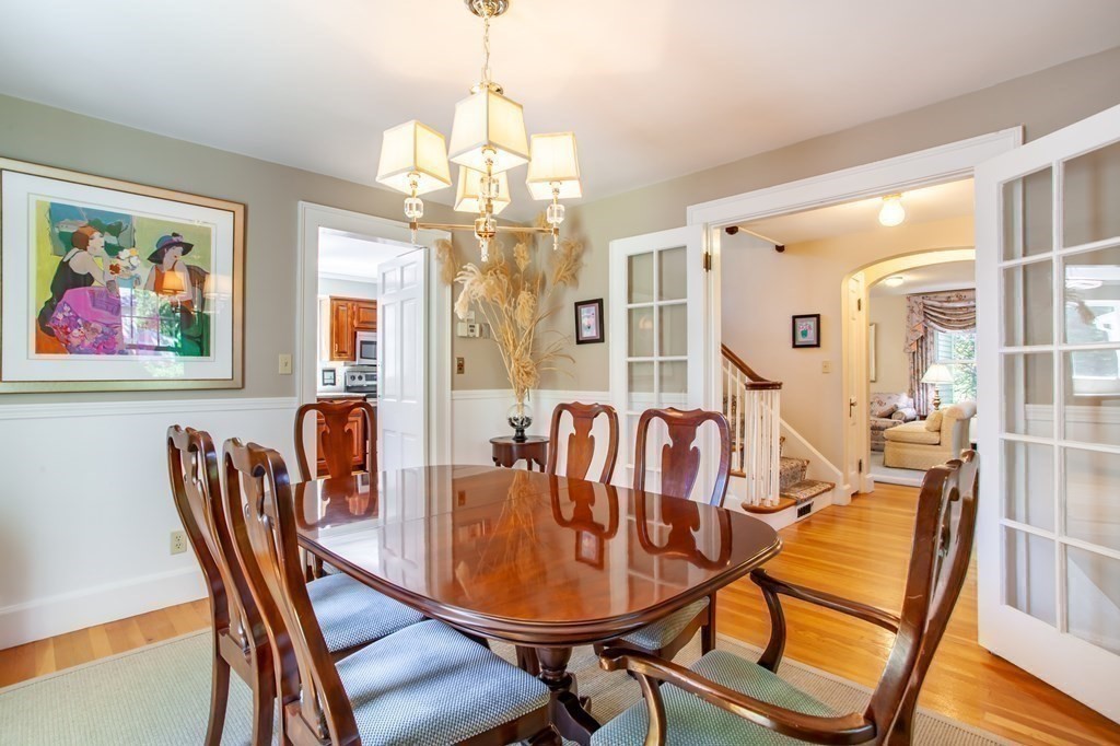 63 Dalton Road Chelmsford, MA 01824 - Photo 10 of 27 a view of a dining room with furniture a chandelier and wooden floor