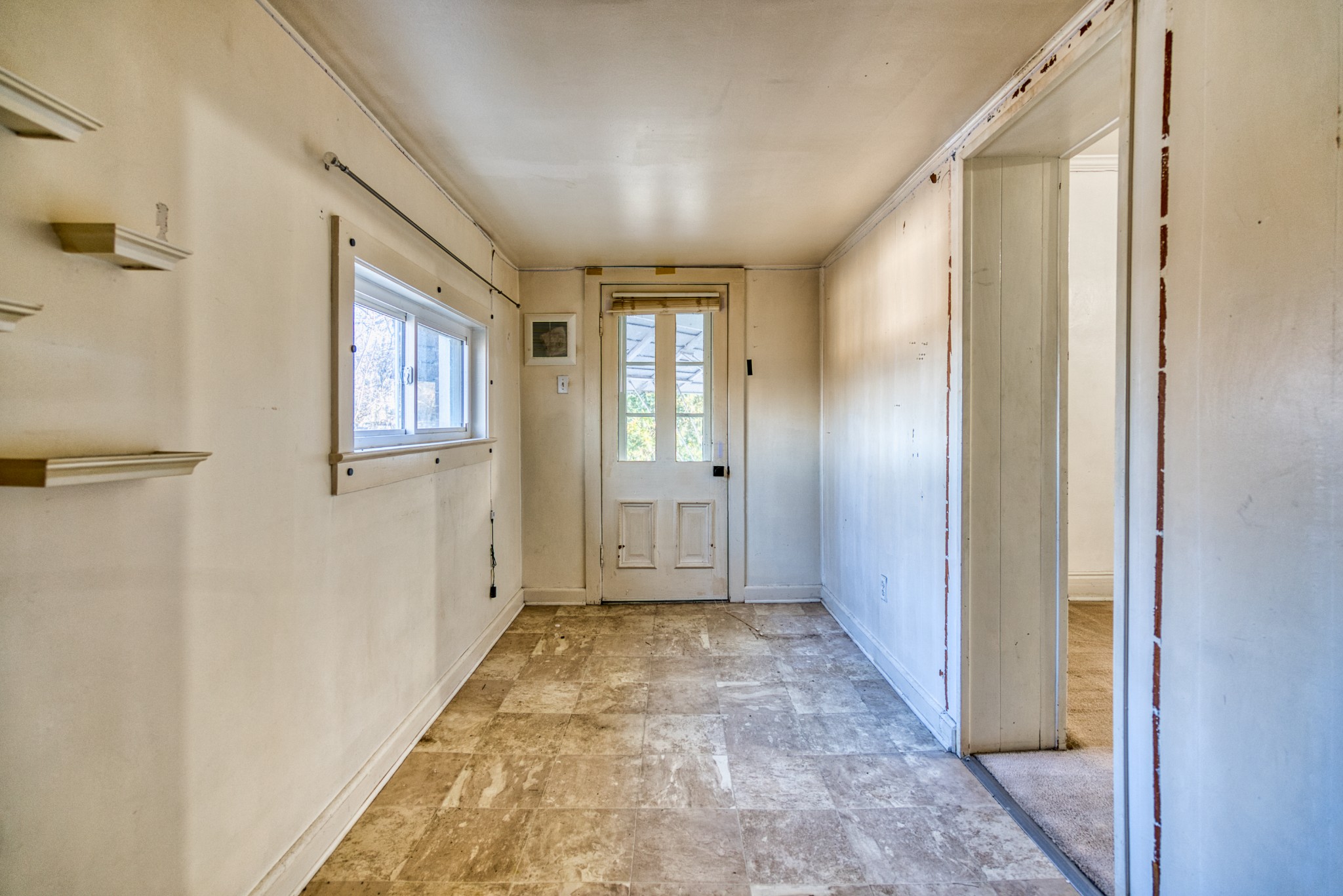 62 North Main Street Springfield, TN 37172 - Photo 33 of 69 a view of a hallway with wooden floor and a bathroom