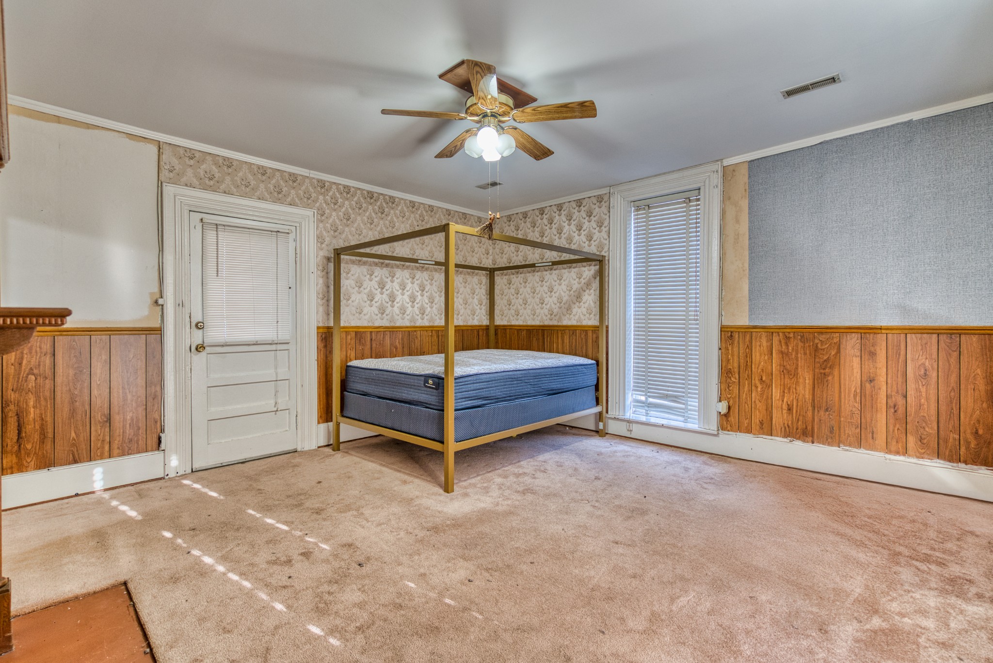 62 North Main Street Springfield, TN 37172 - Photo 40 of 69 a bedroom with a bed and a chandelier