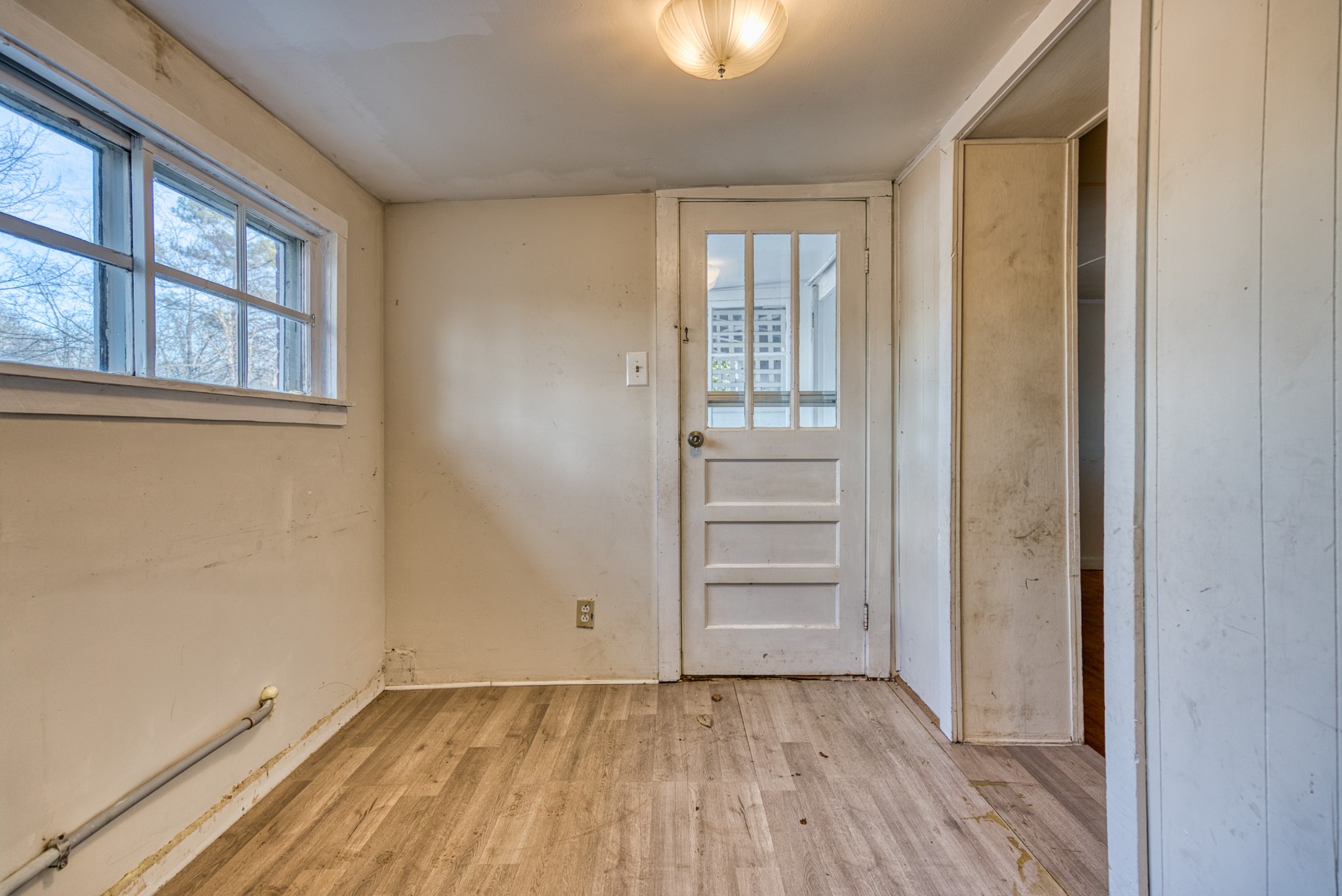 62 North Main Street Springfield, TN 37172 - Photo 52 of 69 wooden floor in an empty room with a window
