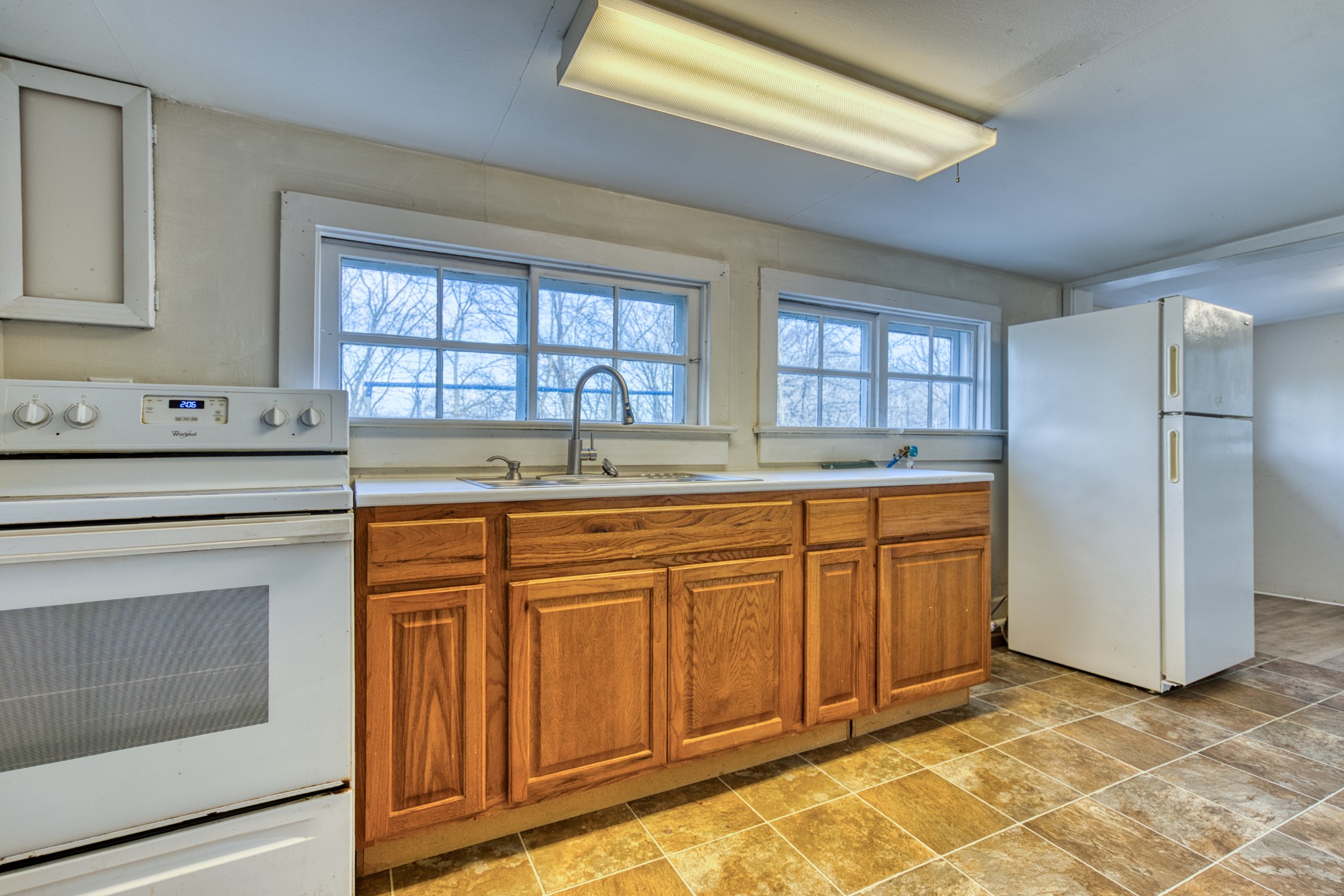 62 North Main Street Springfield, TN 37172 - Photo 55 of 69 a kitchen with granite countertop a sink stainless steel appliances and cabinets
