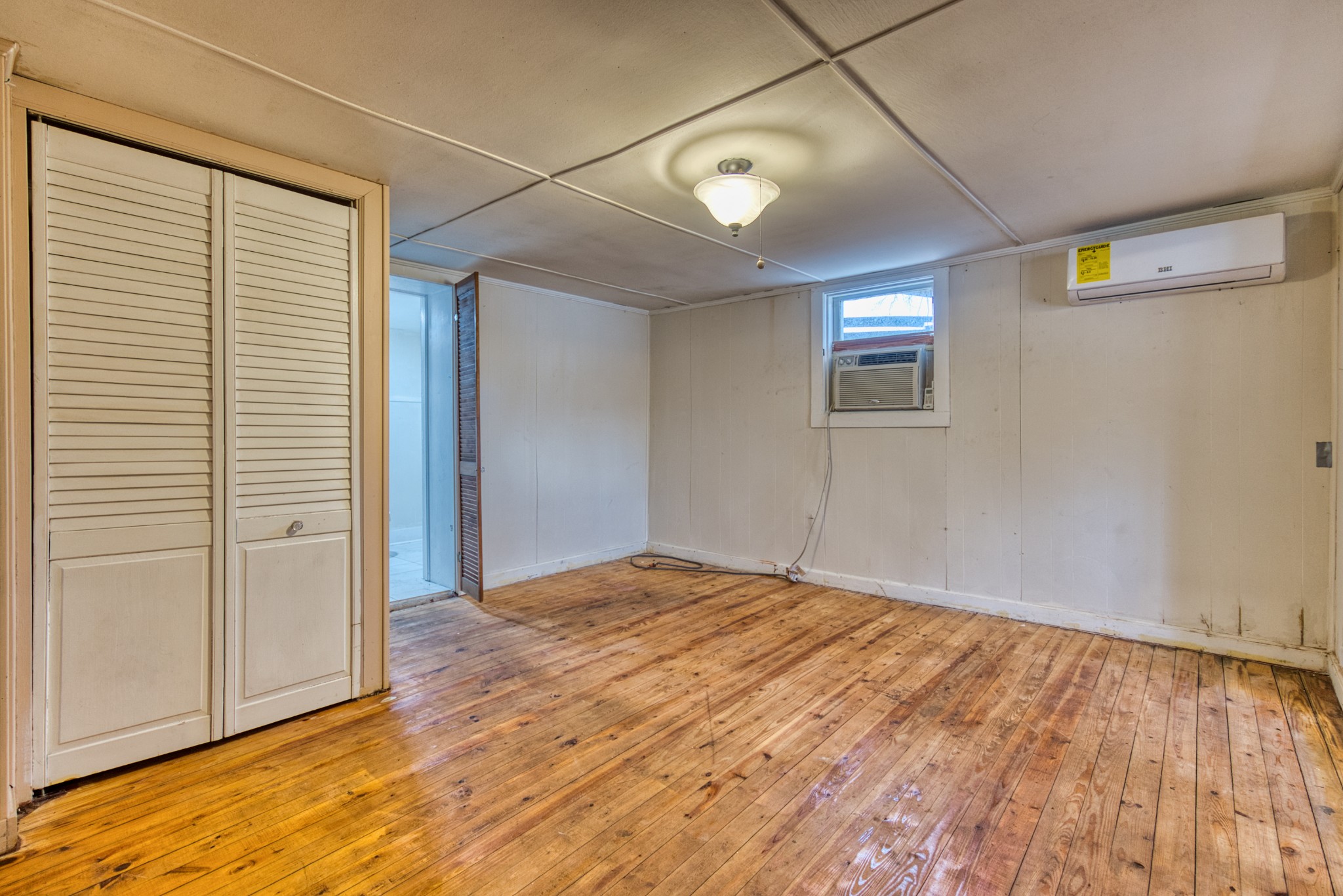 62 North Main Street Springfield, TN 37172 - Photo 57 of 69 an empty room with wooden floor and windows
