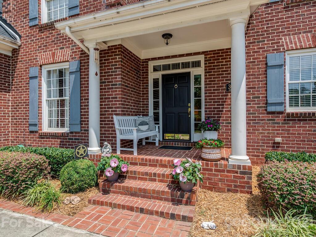 3025 Sharon Road Charlotte, NC 28211 - Photo 2 of 32 a front view of a house with a porch