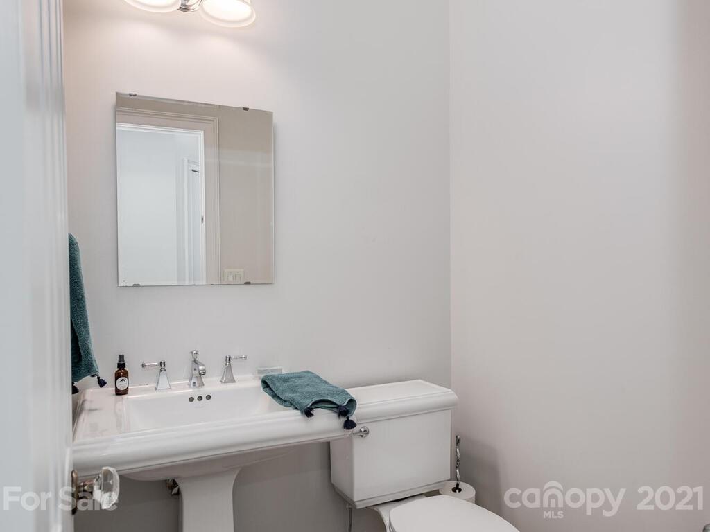 3025 Sharon Road Charlotte, NC 28211 - Photo 13 of 32 a bathroom with a sink and a toilet