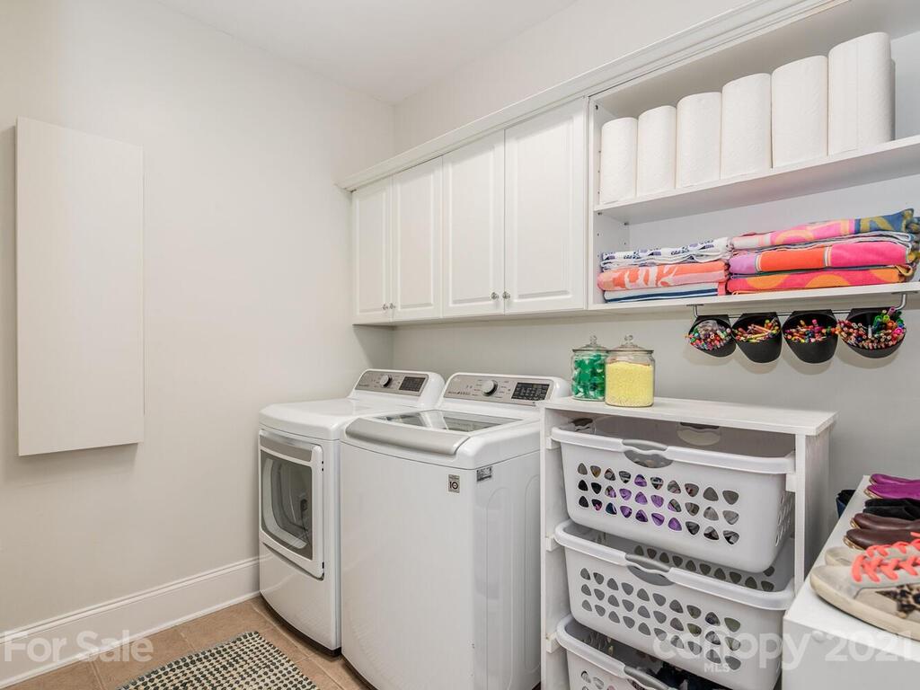 3025 Sharon Road Charlotte, NC 28211 - Photo 14 of 32 a utility room with stainless steel appliances cabinets and a window