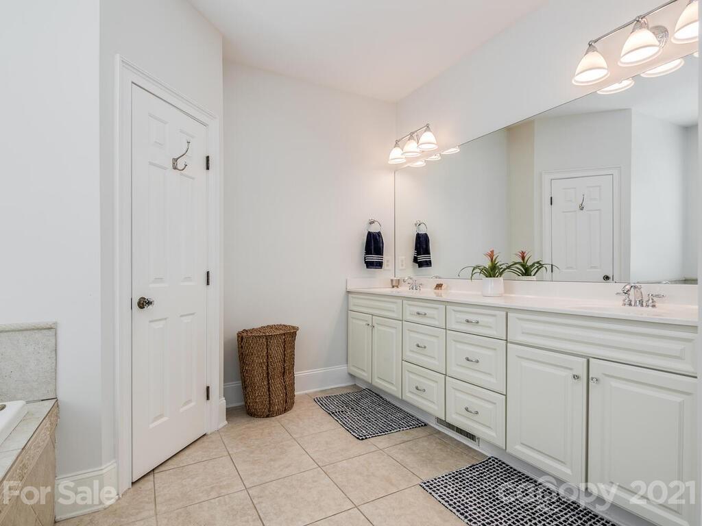 3025 Sharon Road Charlotte, NC 28211 - Photo 18 of 32 a bathroom with a double vanity sink mirror and
